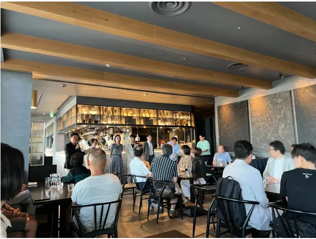 ハイクアインターナショナルの事業報告会の様子